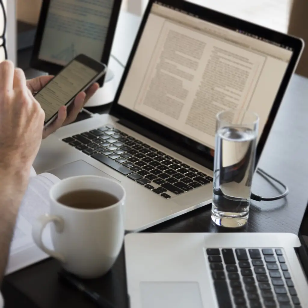 midsection man using laptop table